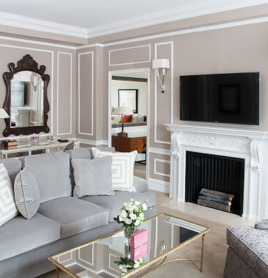 Beautiful moldings and fireplace cast a warm vibe in City View Suite #2309.