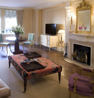 Park View Suite #301 is a two-bedroom suite with views of Central Park and detailed moldings and fireplace.