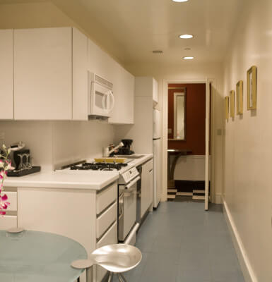 Park View Suite #301 has a full kitchen complete with microwave, stove, and refrigerator.