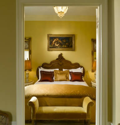 Suite #1909 offers a lovely bed and chandelier.