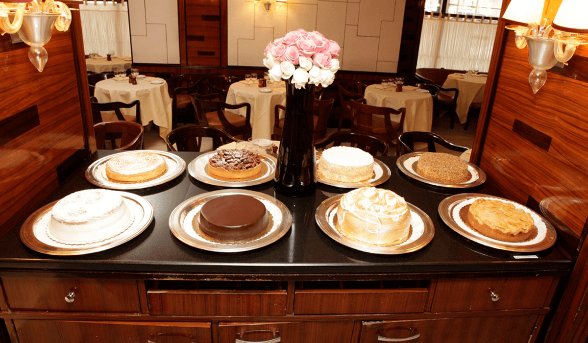 Selection of elegant plated desserts displayed at Harry Cipriani restaurant in New York City
