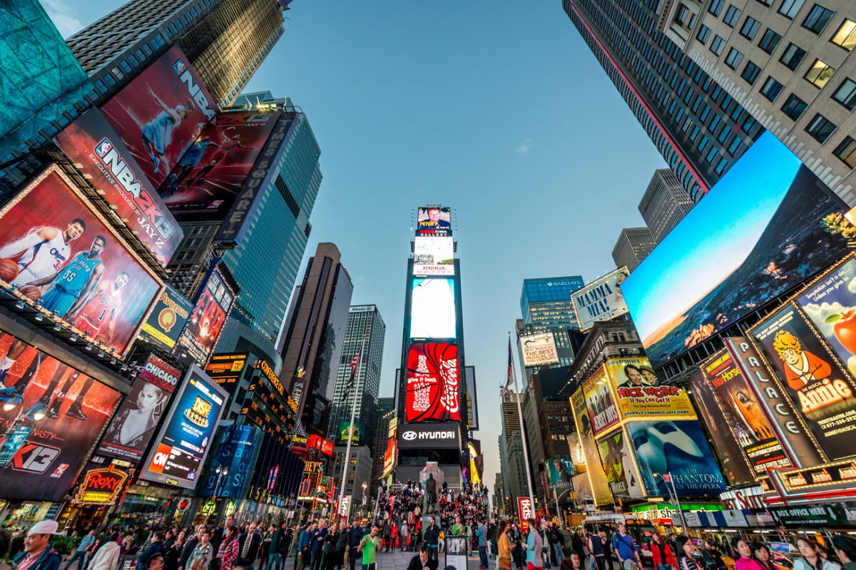 Iconic Times Square glowing with energy and lights in Midtown Manhattan