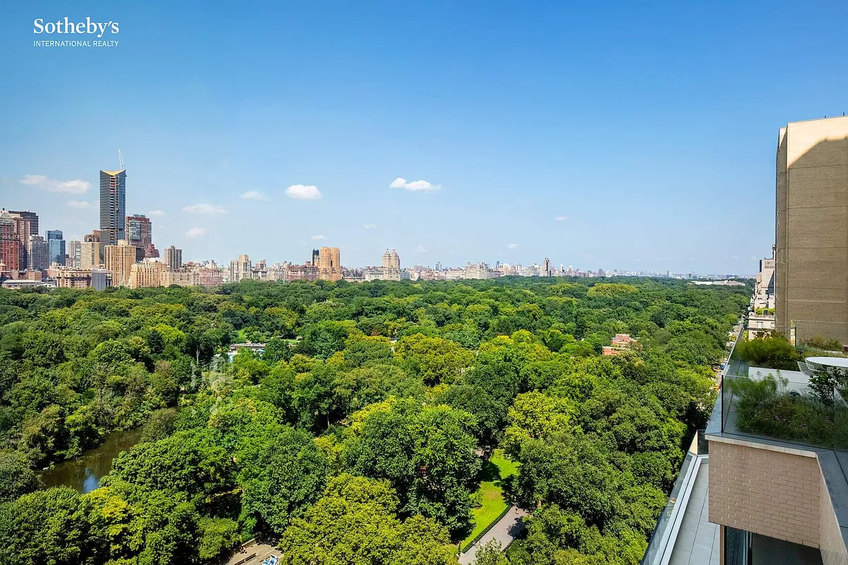 Panoramic vista of Central Park, showcasing its trees, lake, and the surrounding urban landscape, captured from an elevated vantage point at The Sherry-Netherland.