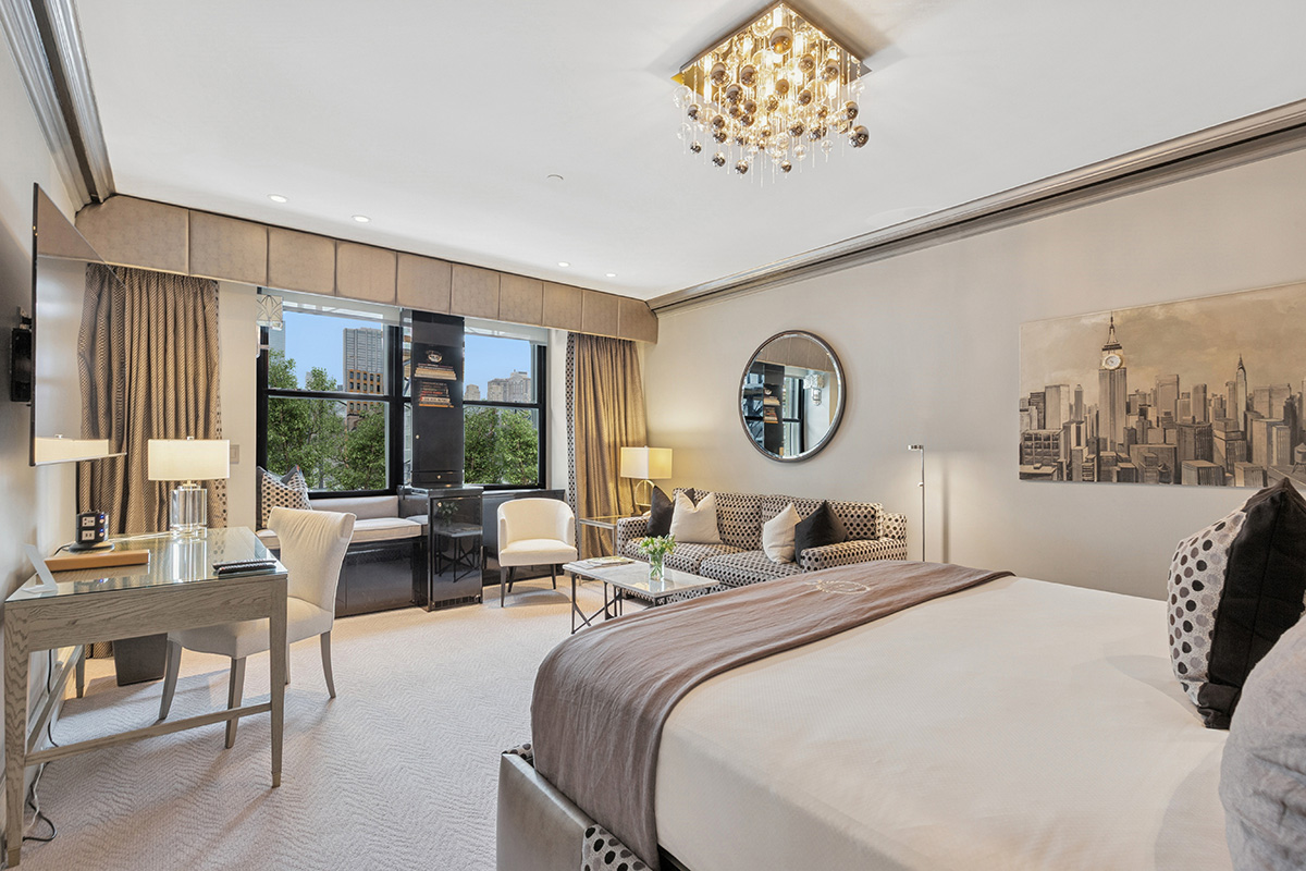 Elegant guest room at The Sherry-Netherland with Central Park view, custom furnishings, and neutral décor